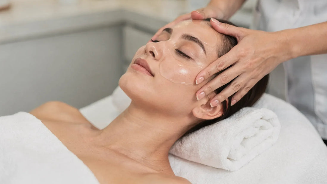 Licensed esthetician performing a hands-on lifting facial massage during a Lift & Sculpt Manual Facial at Lumina Skin Sanctuary in Fort Myers, FL