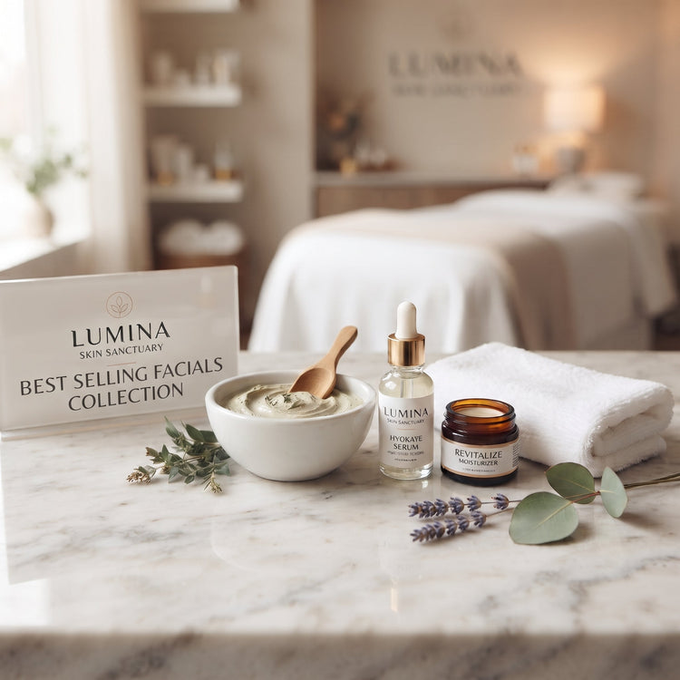 Lumina sign reading Best Selling Facials Collection beside a clay mask bowl, serum bottle and folded towel on a marble counter in a Fort Myers, FL facial studio