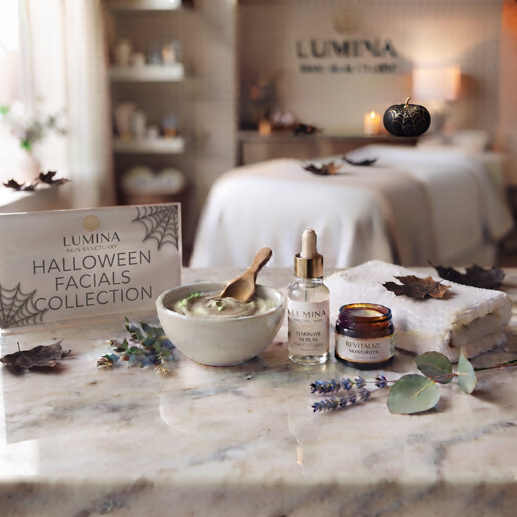 Lumina sign reading Halloween Facials Collection with spiderwebs beside a clay mask bowl, serum bottle and towel with autumn leaves on a marble counter in a Fort Myers, FL facial studio